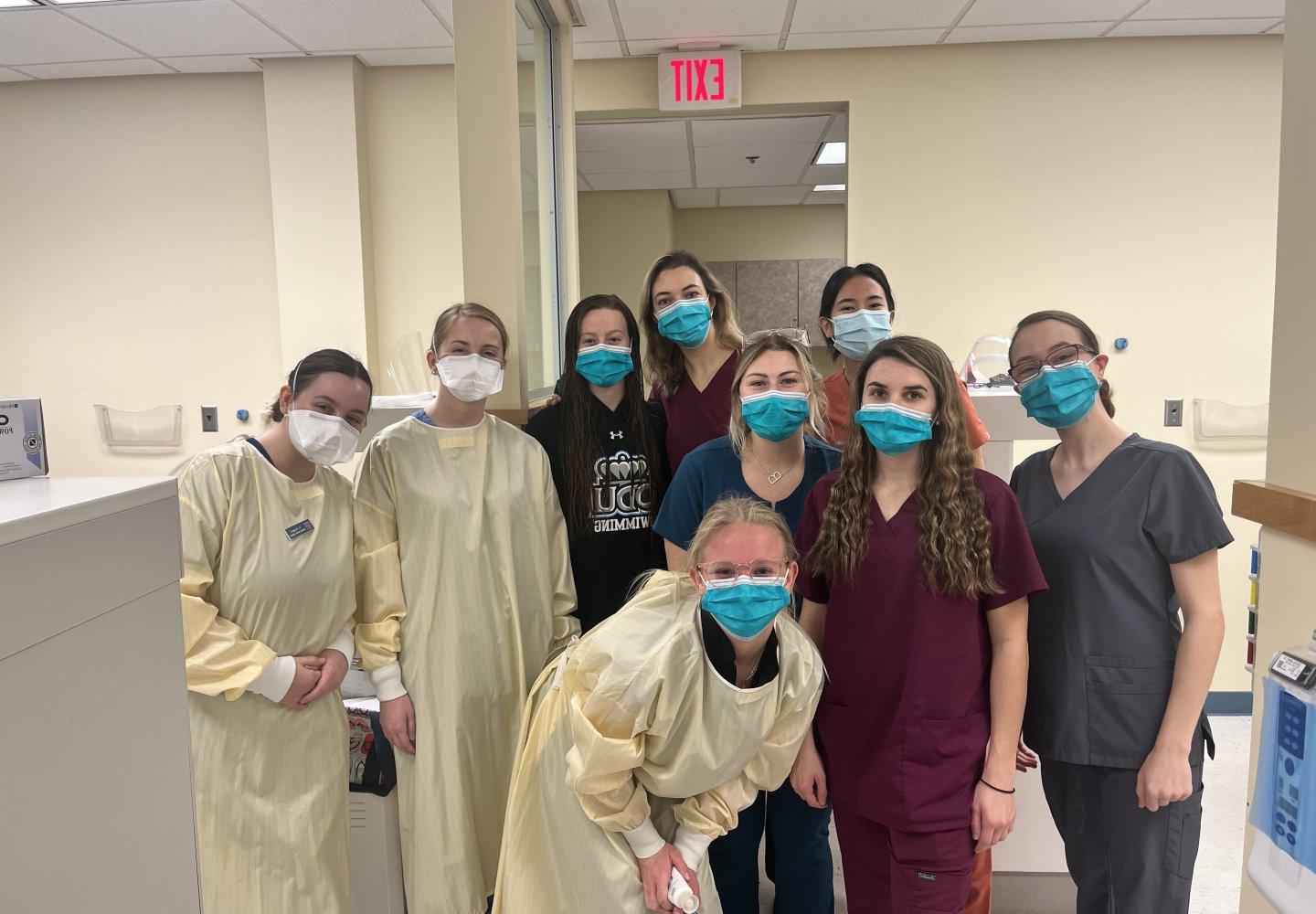 group of dental hygiene students posing for a photo 